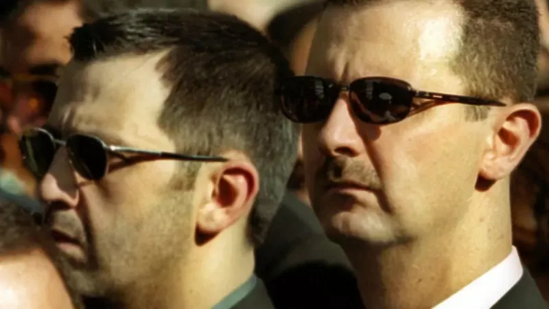 RAMZI HAIDAR El presidente sirio y su hermano menor, Maher al-Assad.